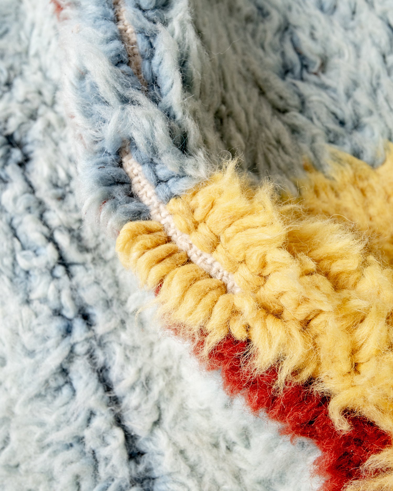 Modern, designer, handcrafted Berber rug from Morocco. Beniourain carpet with beautiful colours and patterns and fluffy wool texture.